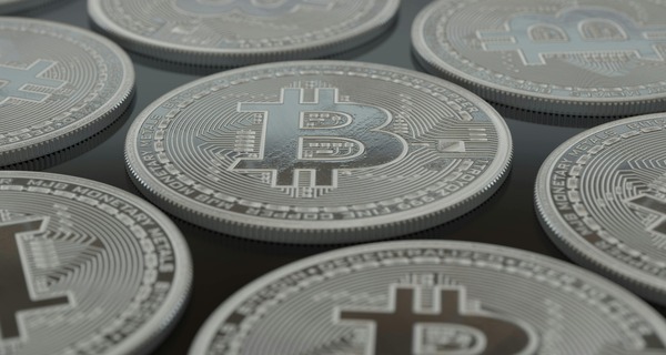 Macro close-up of silver Bitcoin-branded coins